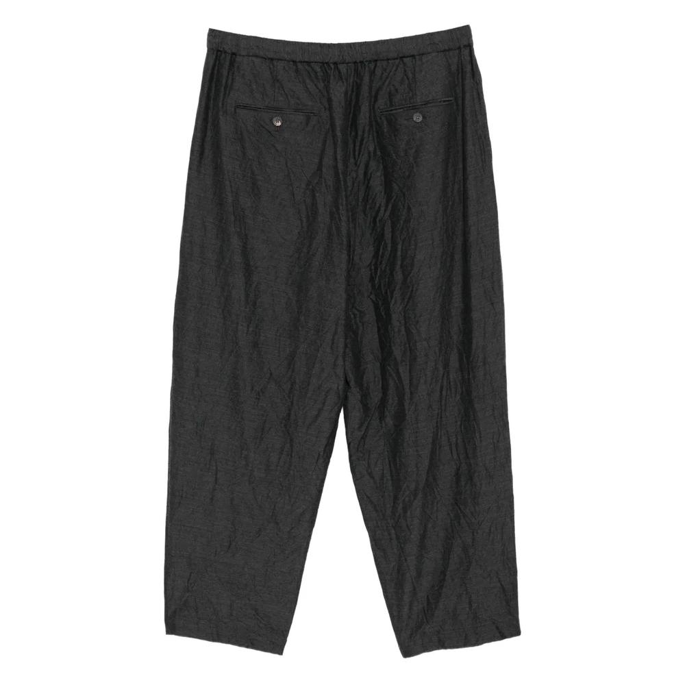 Зауженные брюки со складками 2