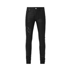 Джинсы Amiri Waxed Staggered Logo Skinny Jean 'Черный воск'