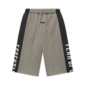 Спортивные штаны Fear of God Essentials Panelled Raw Cut Off Sweatpant 'Seal Heather/ Iron Grey'