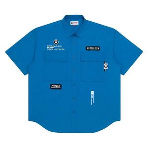 Рубашки и топы AAPE рубашка с карманом Moonface «Blue»